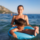Caring mother rides her son on an inflatable ring in the sea - PhotoDune Item for Sale