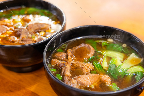 Warm and comforting bowl of beef noodle soup - Stock Photo - Images