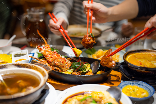 Family dinner together in restaurant - Stock Photo - Images