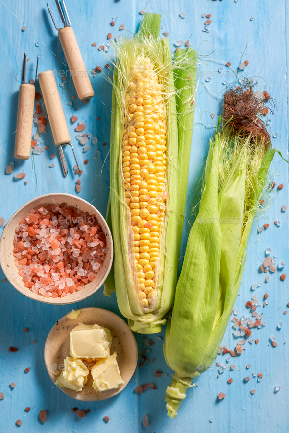 Preparations for grilling homemade corncob with butter and salt. - Stock Photo - Images