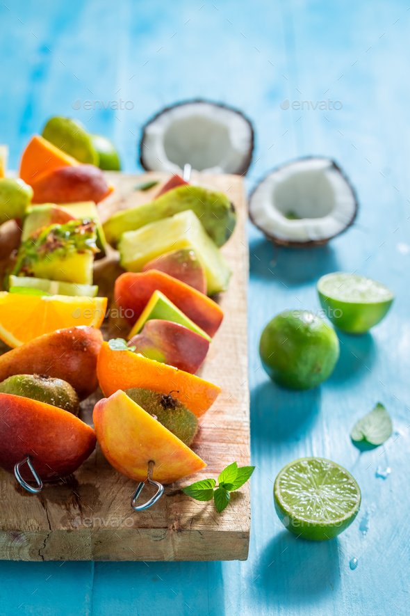 Tasty and sweet skewers with many exotic fruits for party. - Stock Photo - Images