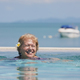 Active laughing senior woman is swimming in pool - PhotoDune Item for Sale
