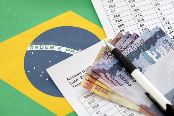 Pen with Brazilian money bills on blank of lottery game. Concept of luck and gambling in Brazil - Stock Photo - Images