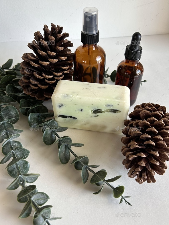 Spa time with essential oil, massage soap with eucalyptus and pine cones - Stock Photo - Images