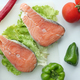 Raw, fresh salmon steak and vegetables on white  - PhotoDune Item for Sale