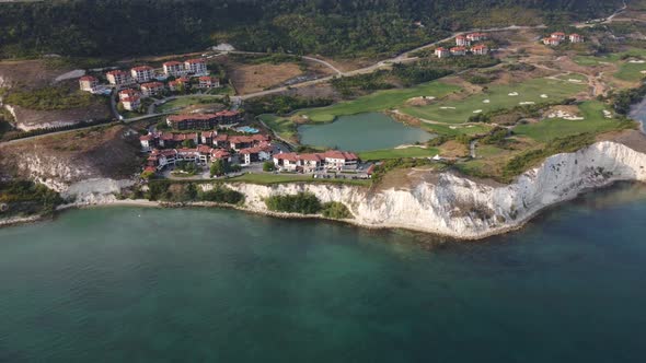Aerial View of Beautiful Luxury Outdoor Swimming Pool in Hotel Resort Near the Sea alt