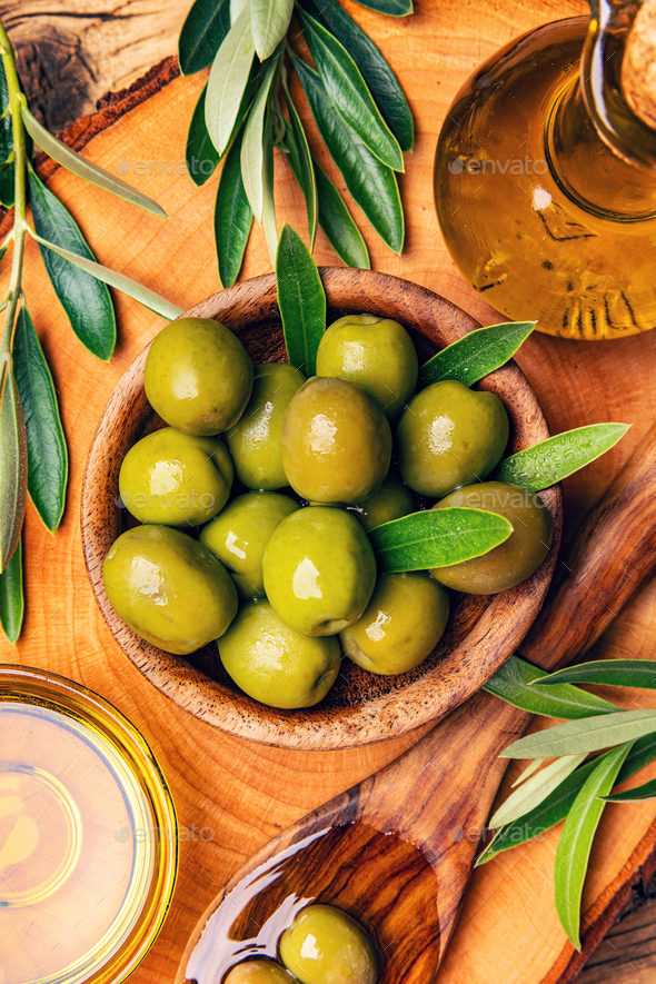 Wooden bowl with green olives - Stock Photo - Images