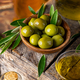 Green olives in wooden bowl - PhotoDune Item for Sale