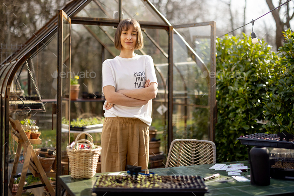 Portrait of a young female gardener - Stock Photo - Images