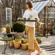 Female gardener with a seedling tray in beautiful garden - PhotoDune Item for Sale