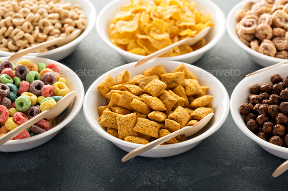 Variety of cold cereals in white bowls with spoons Stock Photo by ...