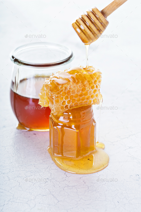 Jar of honey and Stock Photo by fahrwasser PhotoDune
