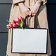 Lifestyle mockup Woman carrying a minimal paper bag. Woman holding white shopping eco bag against - PhotoDune Item for Sale