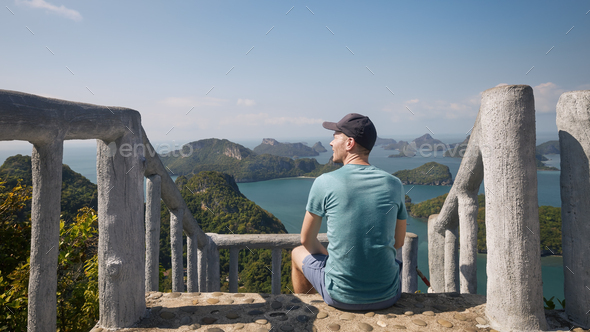 Man looking at sea with group tropical islands - Stock Photo - Images