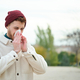 Man blowing nose into tissue during winter, flu. - PhotoDune Item for Sale