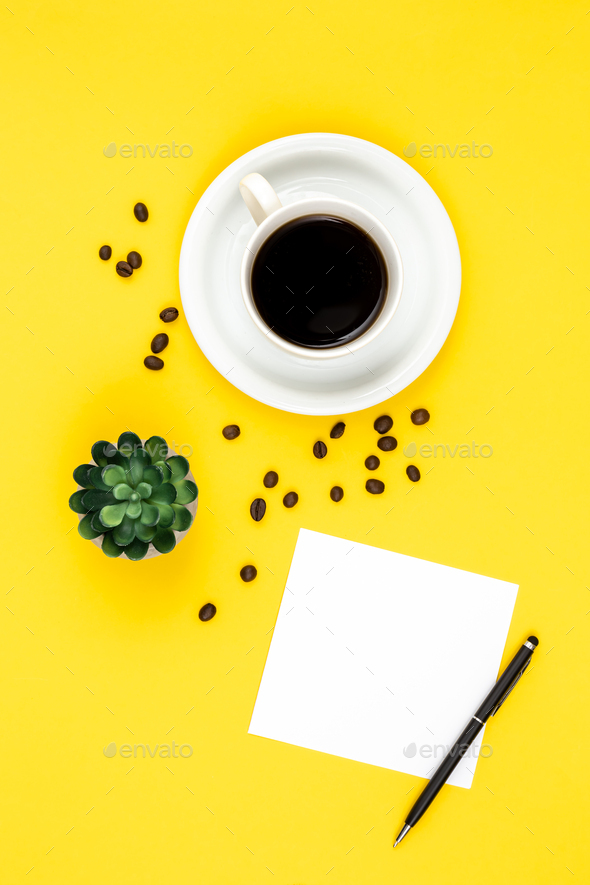 Cup of coffee, paper and coffee beans on a yellow background, flat lay. - Stock Photo - Images