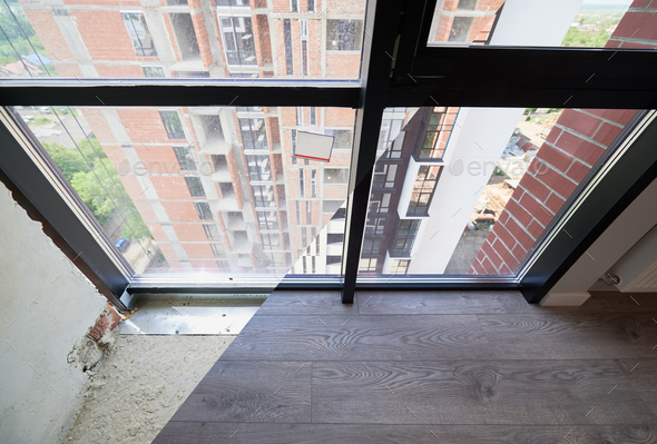 Apartment with panoramic window before and after renovation.