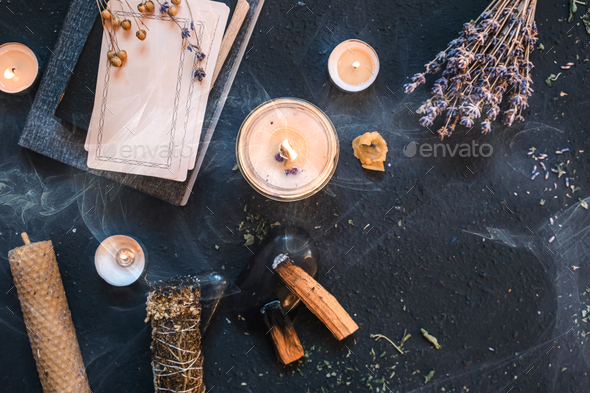 Tarot, astrology,Esoteric, Occult mystical ritual scene of sorcery tarot candles,dried flowers, palo - Stock Photo - Images