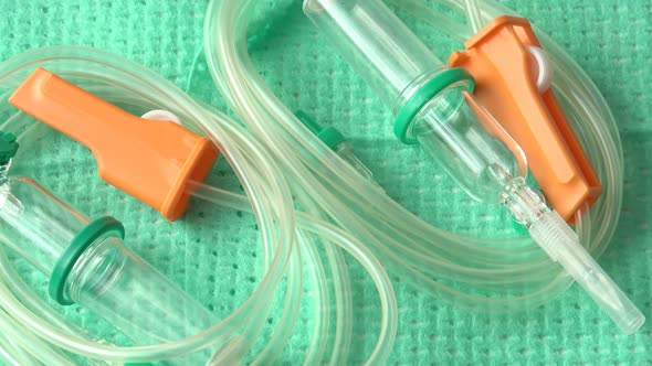 Disposable infusion set on green background