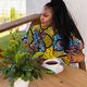 African american woman drinking tea on cozy balcony or terrace wooden country house in weekend on - PhotoDune Item for Sale
