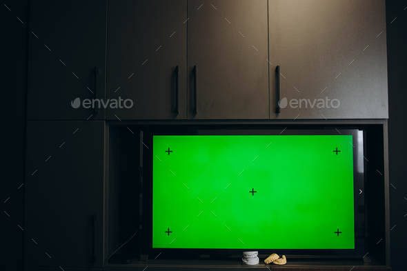 Modern television with chroma key green screen. A modern LCD TV with a green screen