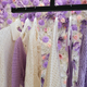 Presentation of different cloths on pastel flowers wall. - PhotoDune Item for Sale