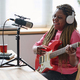 Woman recording her song in studio - PhotoDune Item for Sale