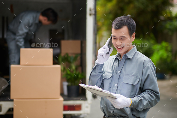 Moving Company Worker Talking on Phone