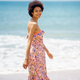 Cheerful ethnic woman enjoying bright summer day at seaside - PhotoDune Item for Sale