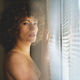 Charming naked woman near window looking at camera - PhotoDune Item for Sale