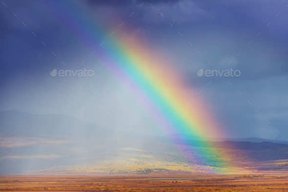 Rainbow in mountains - Stock Photo - Images