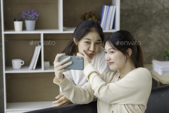 Asian Lesbian Couple Lgbtq Lesbian Couple Holding Smartphone And