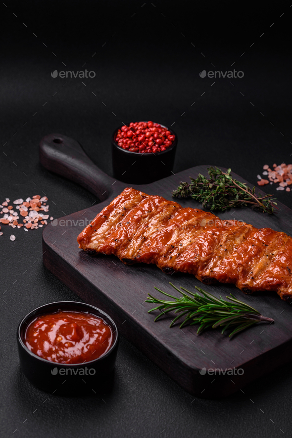 Delicious fresh grilled or smoked ribs with salt, spices and herbs