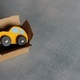 Toy car inside open box. Copy space for text. - PhotoDune Item for Sale