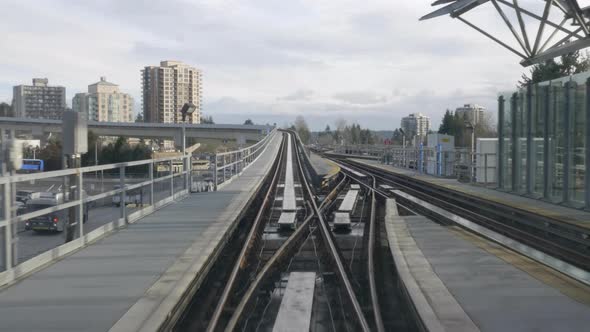 The Millenium Line Sky Train In Vancouver Metro Above The Highways Surrounded With Tall Buildings Un alt