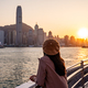 Young woman traveler relaxing and enjoying the sunset atmosphere at Victoria harbour in Hong Kong - PhotoDune Item for Sale