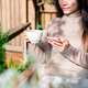 Young female with cup of coffee using mobile phone and relaxing in cafe, Modern lifestyle - PhotoDune Item for Sale