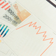Currencies euro and downward graphs representing financial crisis - PhotoDune Item for Sale