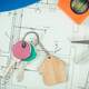 Keys with house shape and electrical construction drawings with work tools - PhotoDune Item for Sale