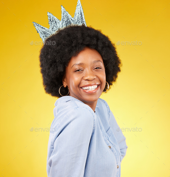 Portrait, queen smile and black woman with crown in studio isolated on a yellow background. Paper,