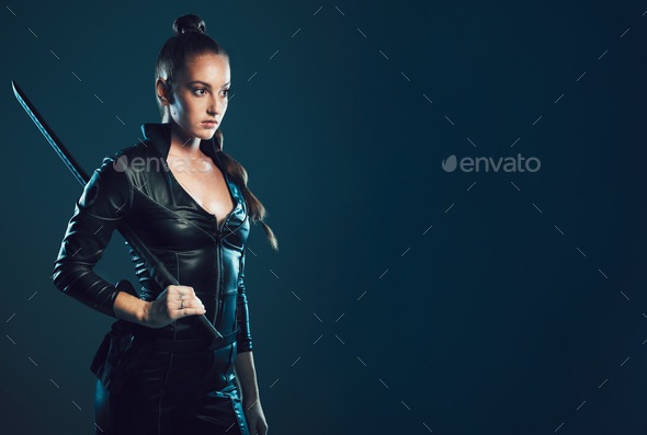Woman, sword and assassin costume in studio with mock up space for action, movie promo or branding.