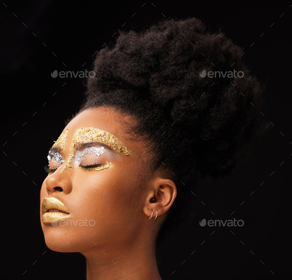 Beauty, gold and glow with black woman and makeup in studio for luxury ...