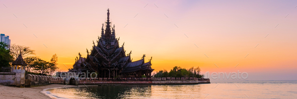 Sanctuary of Truth, Pattaya, Thailand, wooden temple by the ocean at sunset on the beach of Pattaya - Stock Photo - Images