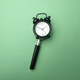 Black alarm clock and magnifying glass - PhotoDune Item for Sale