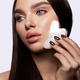 Beauty and skincare concept with a beautiful woman doing skin care routine with gua sha tool. Middle - PhotoDune Item for Sale