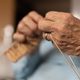 Old woman knitting focus on hands - PhotoDune Item for Sale