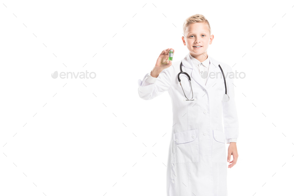 portrait of preteen boy in doctors white coat with stethoscope and medicine isolated on white - Stock Photo - Images