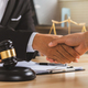 justice and law concept.Legal law, advice and justice, Businessman handshake with a lawyer. - PhotoDune Item for Sale