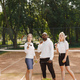 Two women and black race trainer at tennis court - PhotoDune Item for Sale