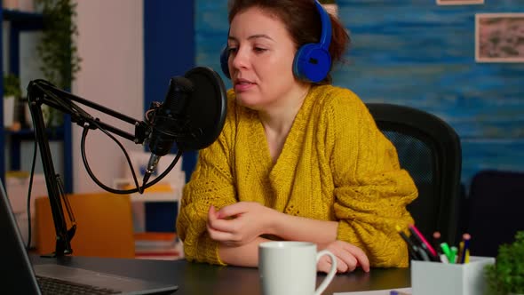 Influencer with Headphones Checking Sound Before Live Vlogging alt